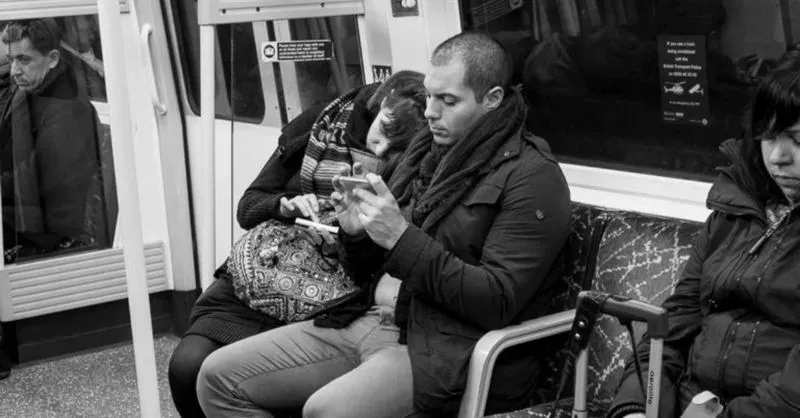 After taking photos of a bunch of strangers, he noticed something awful 