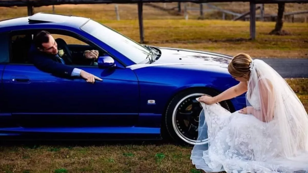 Bride slammed for cleaning husband's car with her wedding dress in 'humiliating ' photo