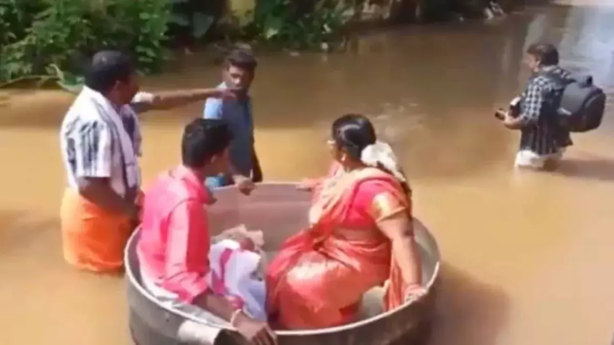 India floods: Couple sail to their wedding in a cooking pot 