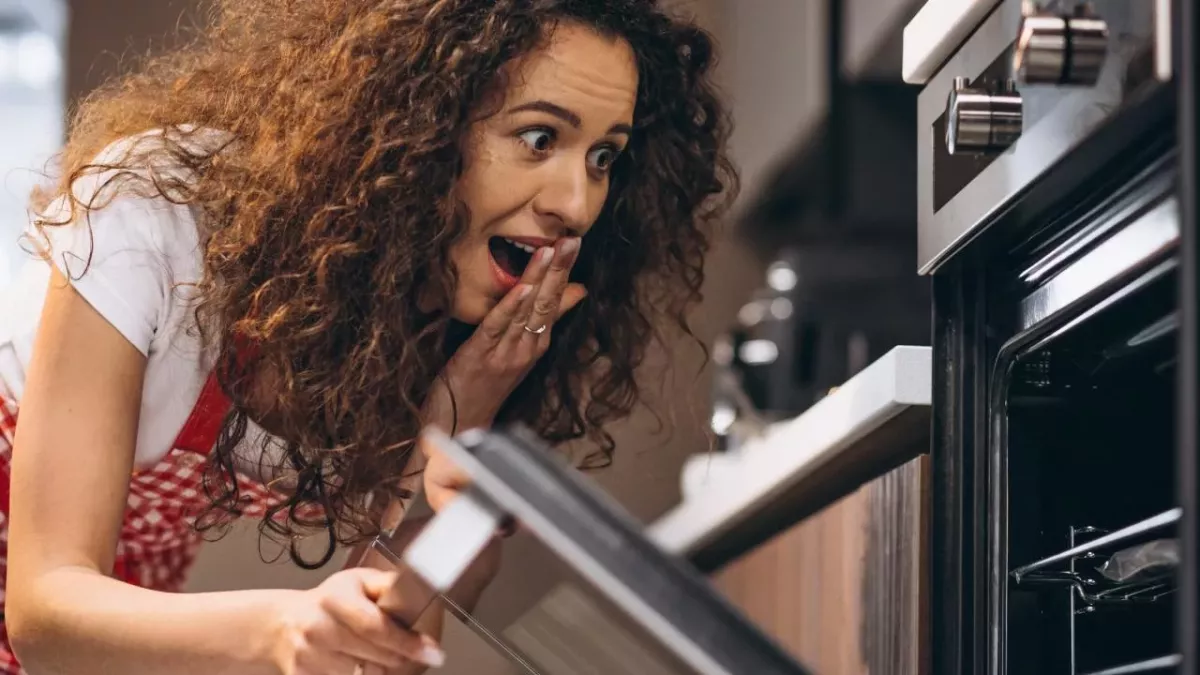 She was baking a cake but she didn't expect to find this in the oven