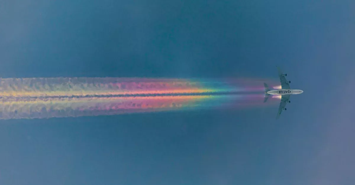 An Airplane Leaves A Spectacular Rainbow Trail