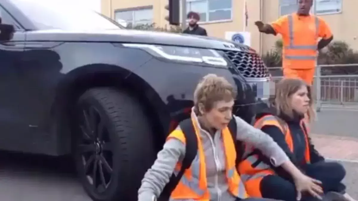 Furious mother drives into Insulate Britain protests with her luxury SUV