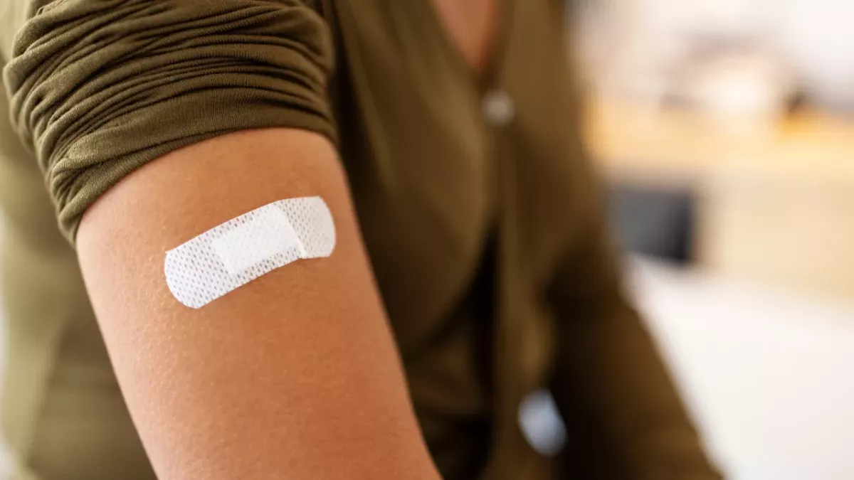Booked your COVID booster shot? Here's the most common side effects and how to ease them