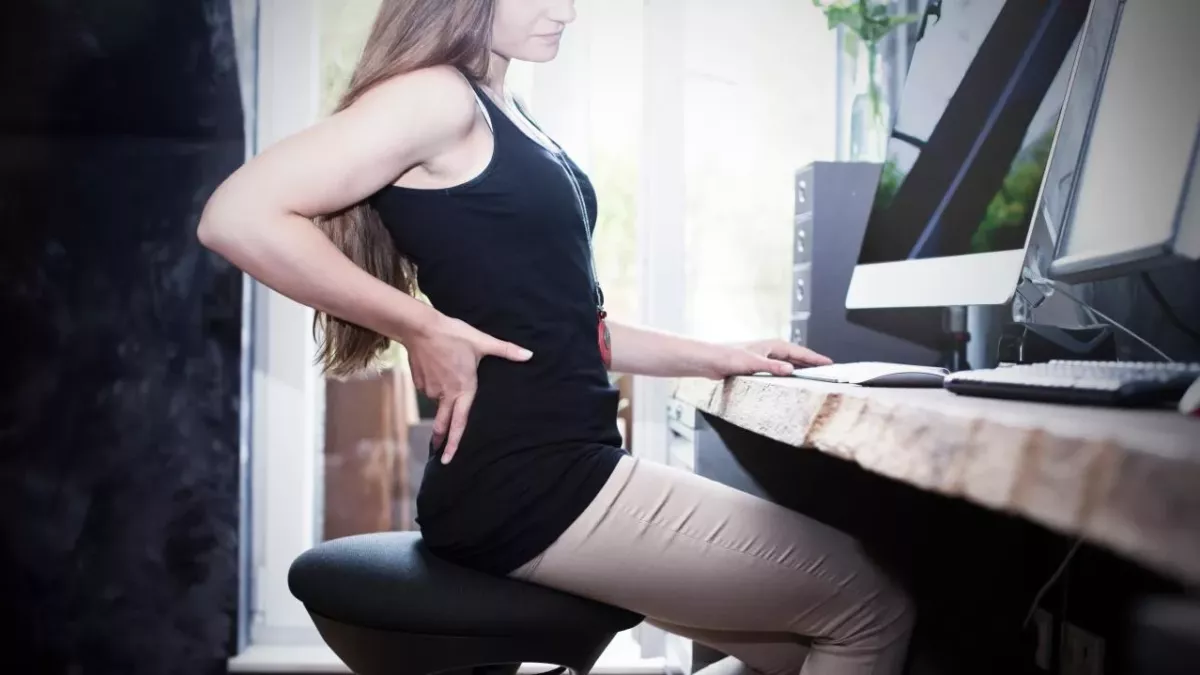 Woman sitting in pain