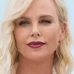 Charlize Theron Decided To Go For A Dary Bold Look With Her Platinum Pixie Cut And Fishnet Dress