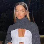 Maura Higgins shows a glimpse of her saucy nipple piercing
