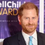 Prince Harry laughing child grabs beard official visit