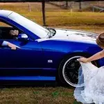 Bride slammed for cleaning husband's car with her wedding dress in 'humiliating ' photo