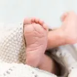 Newborn baby survives two days in the forest covered in worms and insects