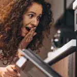 She was baking a cake but she didn't expect to find this in the oven