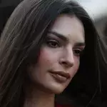 Emily Ratajkowski shows off her backside in an almost invisible swimsuit