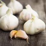 Here is how eating garlic can help slim you down