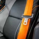 reason mysterious button on car seatbelt