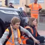 Furious mother drives into Insulate Britain protests with her luxury SUV