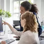 Women looking at computer screen