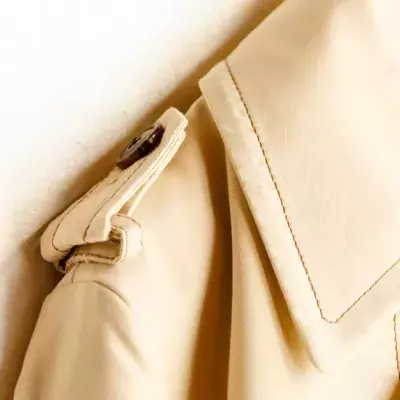 This Is What Those Buttons On Your Coat’s Shoulders Are Actually For