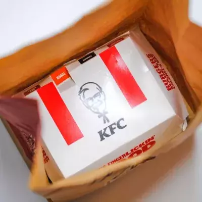 Stunned KFC customer finds a stack of cash underneath her chicken sandwich