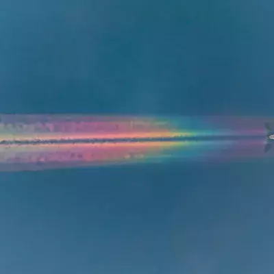 An Airplane Leaves A Spectacular Rainbow Trail