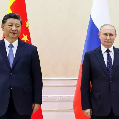 Chinese President Xi Jinping, left, and Russian President Vladimir Putin pose for a photo on the sidelines of the Shanghai Cooperation Organization (SCO) summit in Samarkand, Uzbekistan, Thursday, Sept. 15, 2022. (Alexandr Demyanchuk, Sputnik, Kremlin Pool Photo via AP)