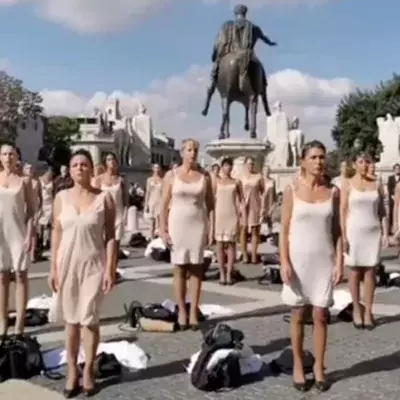 Flight attendants in Italy strip to protest job losses