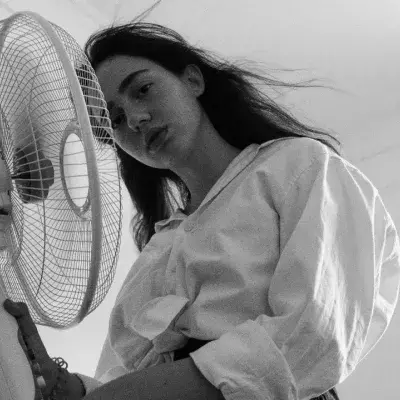 Here's how much it costs to sleep with a fan on vs. air conditioning