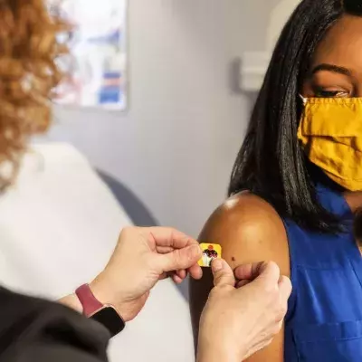 Woman getting vaccine