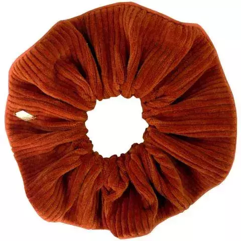 A brick coloured corduroy scrunchie