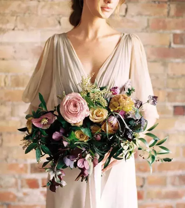 Bridal bouquet: The asymmetrical bouquet including an array of beautiful flowers