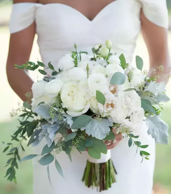 Bridal bouquet: Asymmetrical bouquet with soft greens and beautiful white flowers