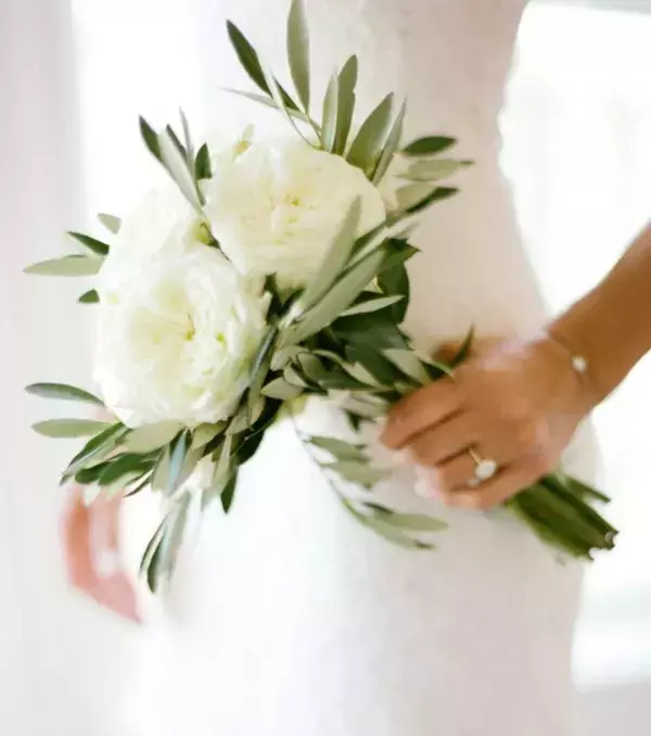 Bridal bouquet: Long bouquet with large white flowers and soft greens