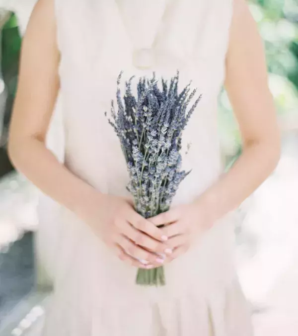 Bridal bouquet: Long lavender bouquet for a simple yet elegant wedding