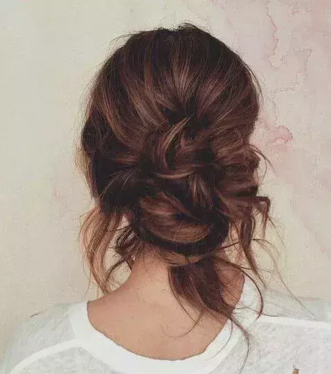 A fully scrunched side bun that would be perfect for a first date!