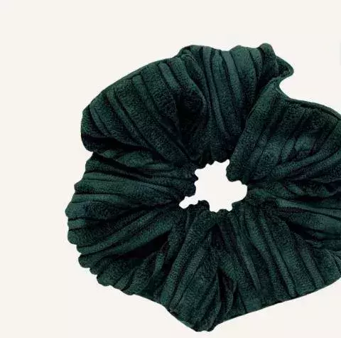 A jade-green velvet scrunchy