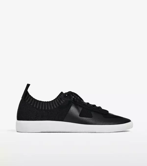 Modern and timeless black trainers by Zara.