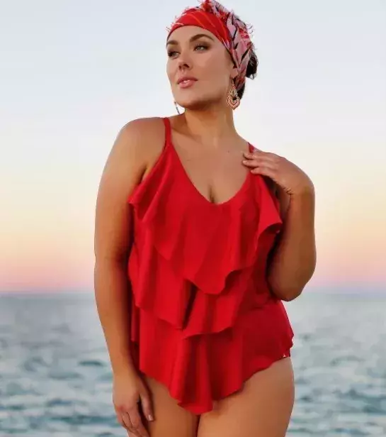Ruffles are a great way to cover lumps. Loose fitting materials are always a sure way to cover the shape of your body.