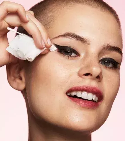 Use a cotton swab as a makeup eraser. Dip it in a little makeup remover and it works just like a charm!
