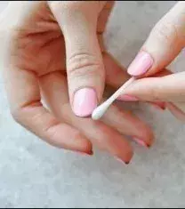 Use a cotton swab as a nail polish eraser. Dip it in a little solution then correct as needed.