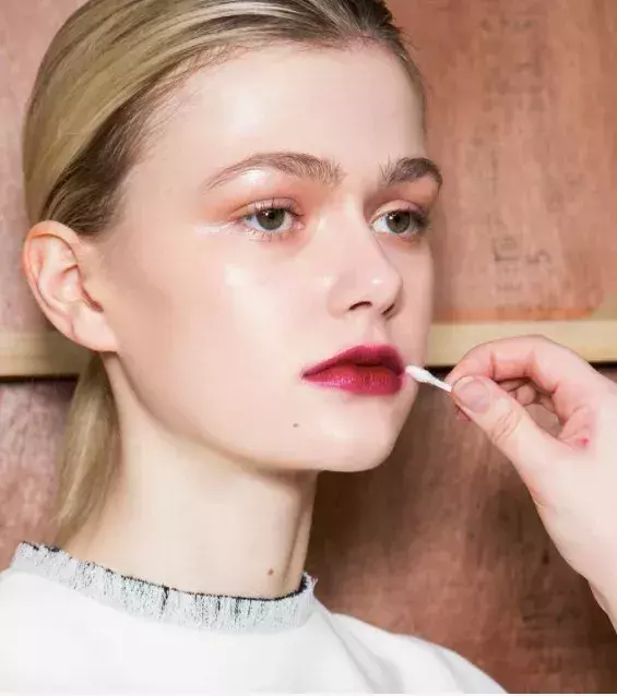 You can apply the red lipstick on your lips but be sure to use a cotton swab or brush to blend and fill in the creases.