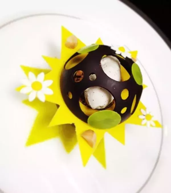 YUMMY! This dessert is composed of caramelised banana, mousse with mascarpone, macadamia nuts, and vanilla ice cream.