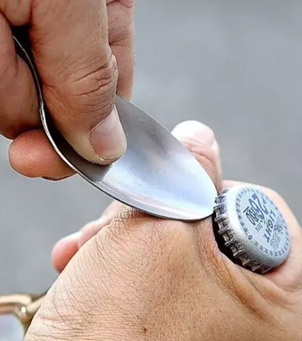 12: Forget the bottle openers, try using a spoon instead! It's a bit tricky but once you get the hang of it, you will enjoy it!