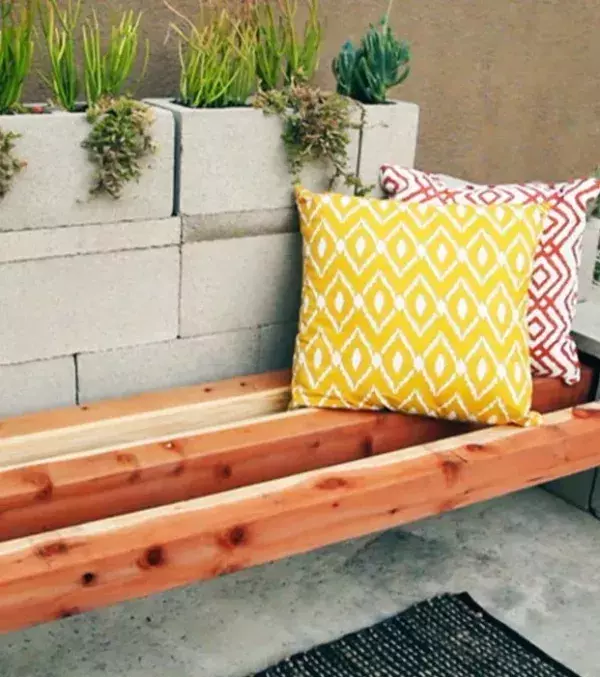 Add cushions and pillows on top of the breeze blocks and you will get a cute and practical bench that you can showoff to your friends.