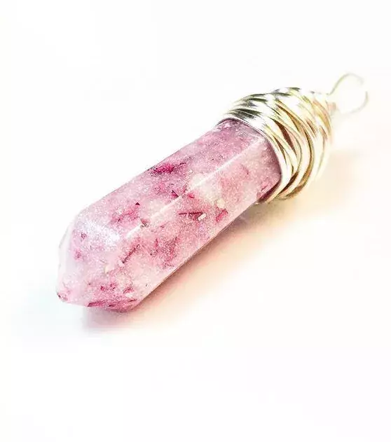 A beautiful necklace pendant with a touch of pink