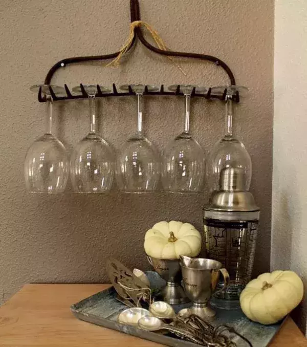 A glass holder made out of a rake's head.