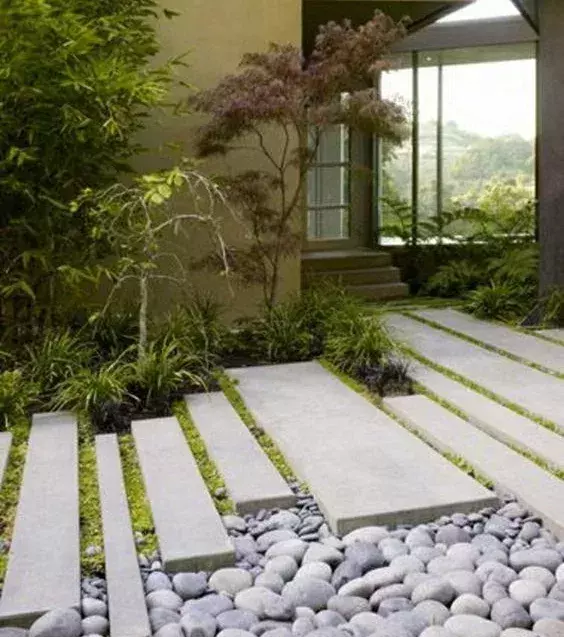 The Japanese believe that odd numbers are favorable. Try not to plant shrubs in pairs of two.