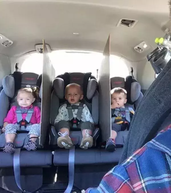 To keep your children from fighting place a piece of cardboard between the seats.