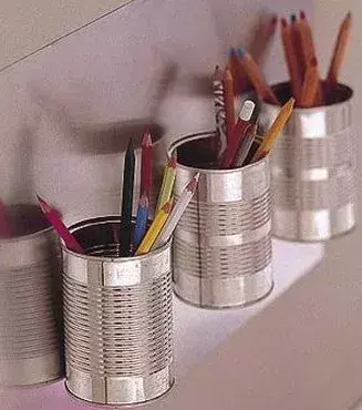 Pencil pots made out of old tin cans.